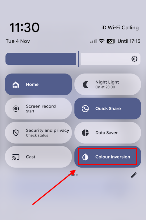 Tap the shortcut button in the Quick Settings panel to turn colour inversion on or off